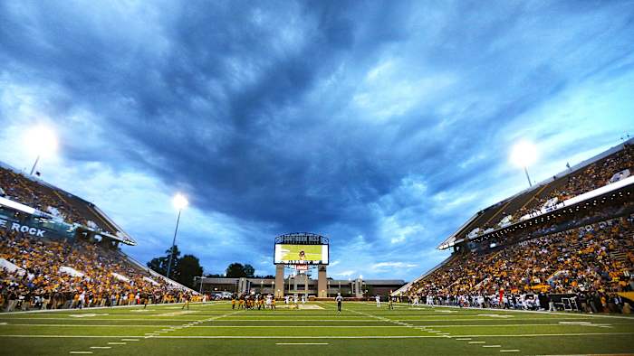Storm clouds above a college football game from 2018